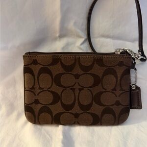 Coach Signature C canvas wristlet.